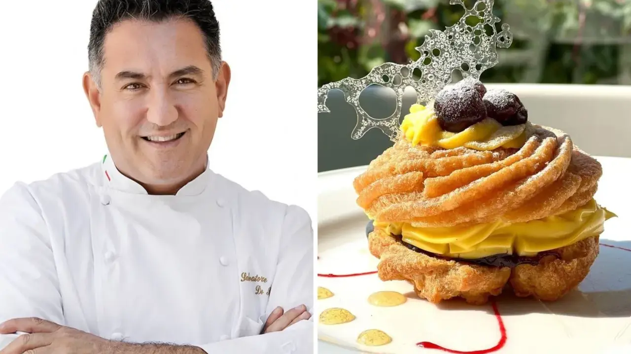 Chef sorridente accanto a una deliziosa zeppola di San Giuseppe, guarnita con crema pasticcera, amarene e decorazione di zucchero.
