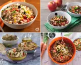 Quattro ciotole di colorata insalata di riso, con ingredienti freschi e vivaci, perfette per un pasto estivo.