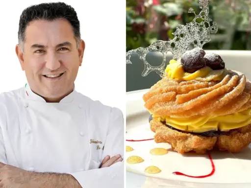 Chef sorridente accanto a una deliziosa zeppola di San Giuseppe, guarnita con crema pasticcera, amarene e decorazione di zucchero.